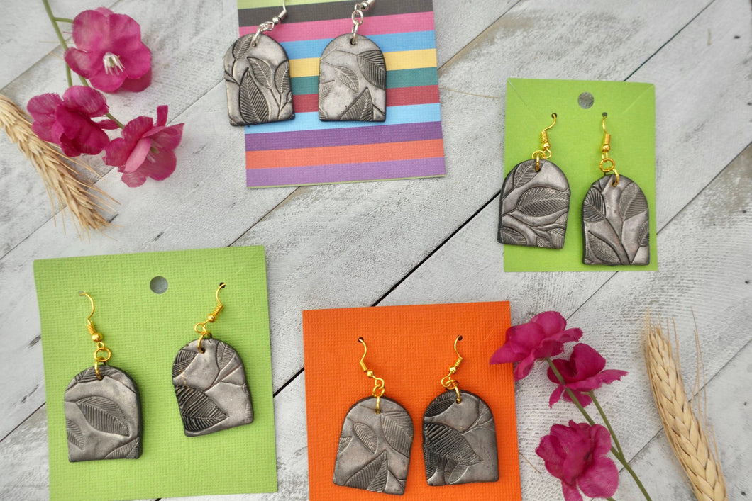 Silver leaf textured arch dangle earrings