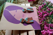 Load image into Gallery viewer, Tan and blue dangle marbled earrings
