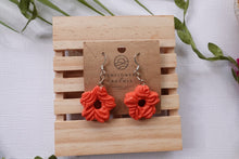 Load image into Gallery viewer, Small orange peach  flower textured polymer clay earrings
