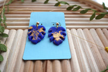 Load image into Gallery viewer, Small Blue and Gold Monstera dangle earrings | polymer clay earrings | handmade
