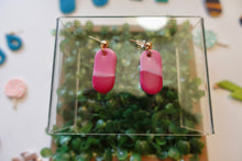 Load image into Gallery viewer, Small pink pill shaped polymer clay earrings
