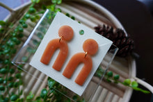 Load image into Gallery viewer, Light Brown polymer clay earrings | arch dangle | clear brown |
