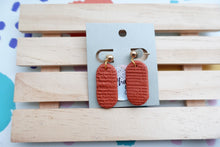 Load image into Gallery viewer, Small textured print | terracotta | pill shape | earrings | handmade
